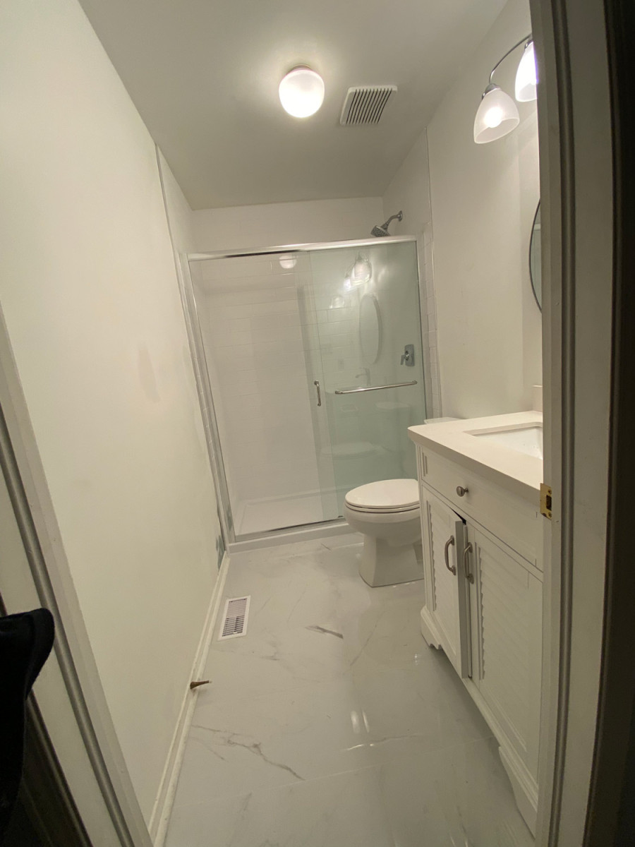 Polished marble flooring with a glossy finish in a bathroom