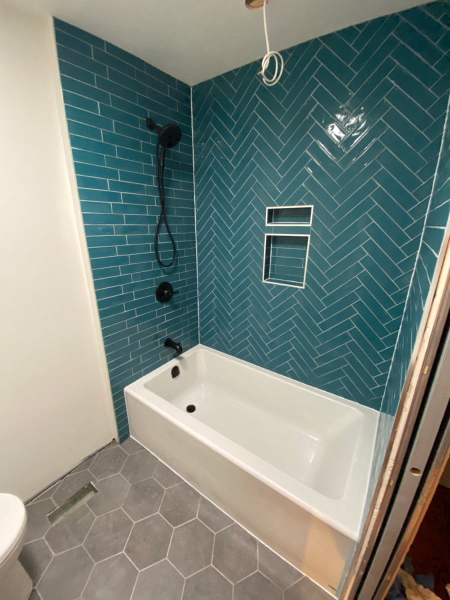 Luxurious bathroom with a rain shower and a freestanding tub