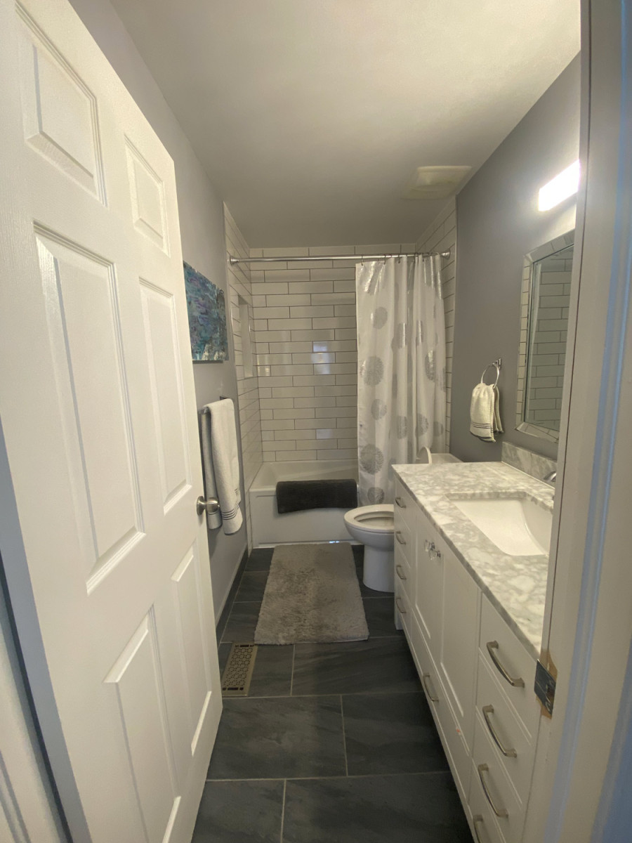 Bathroom with decorative floor tiles