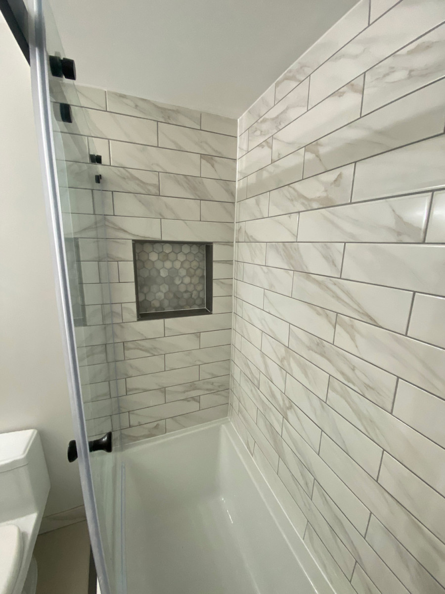 Luxurious bathroom with a soaking tub and panoramic city views