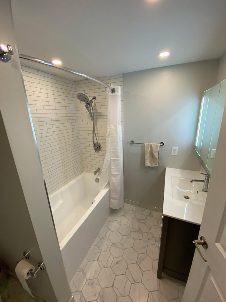 Bathroom with a frameless glass door and chrome fixtures