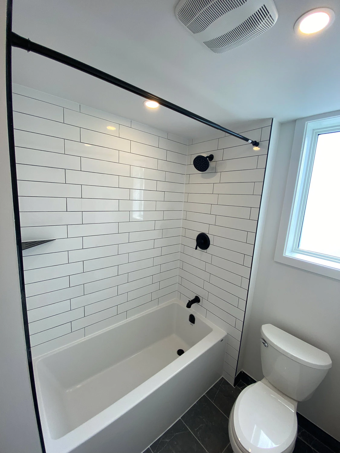 Modern white bathroom with a freestanding tub