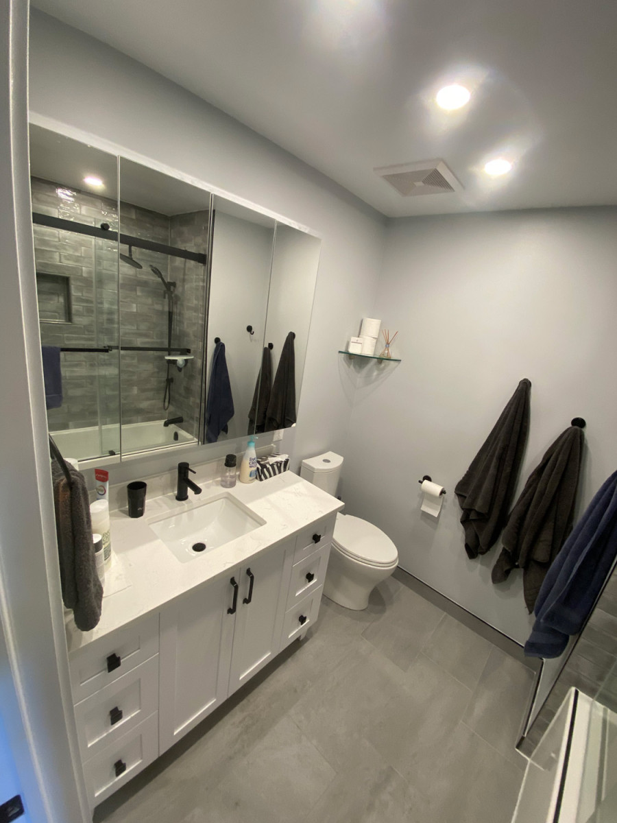 Elegant master bathroom with his-and-hers sinks and marble tiles