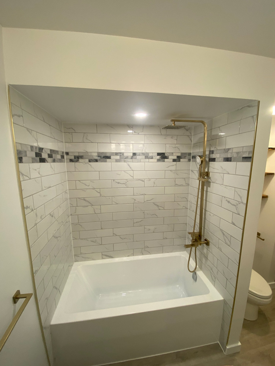 Luxury bathroom featuring a jacuzzi tub and ambient lighting