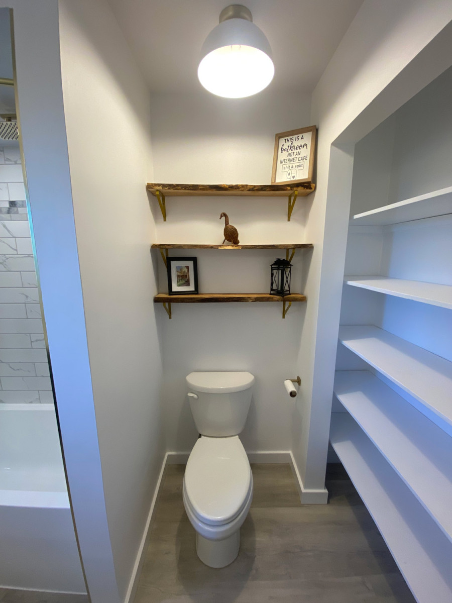 Bright bathroom featuring open shelving