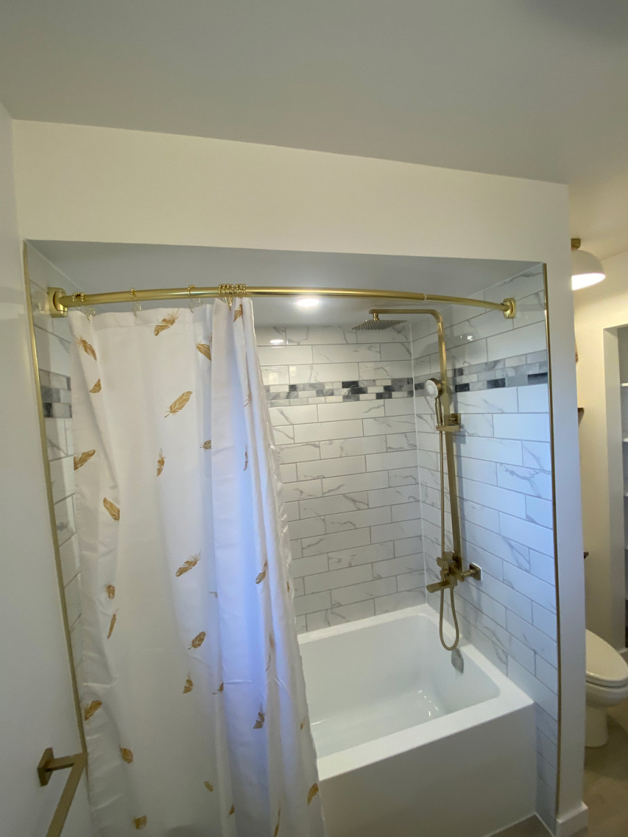 Bright bathroom featuring open shelving