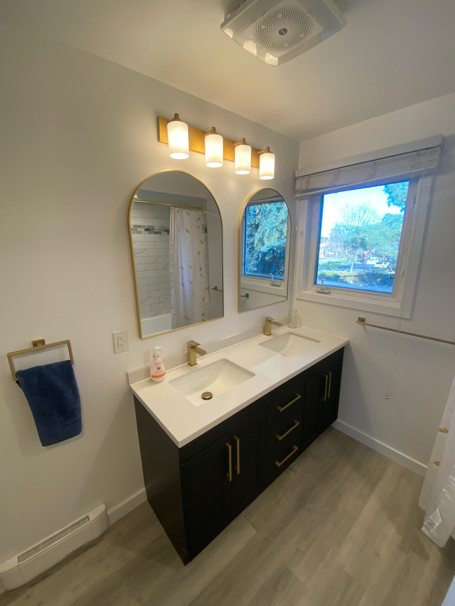 Modern bathroom sink with a sleek countertop and chrome faucet