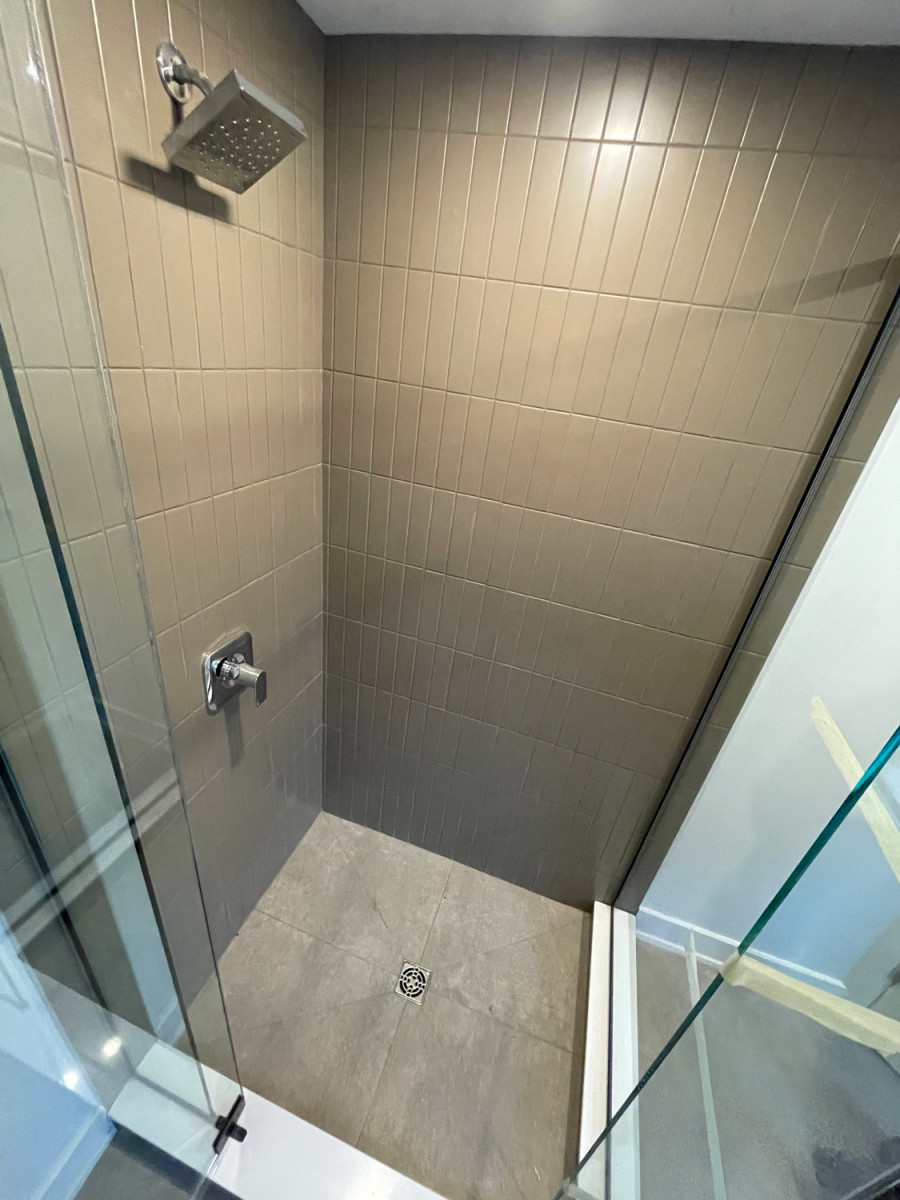 Stylish bathroom featuring a glass shower